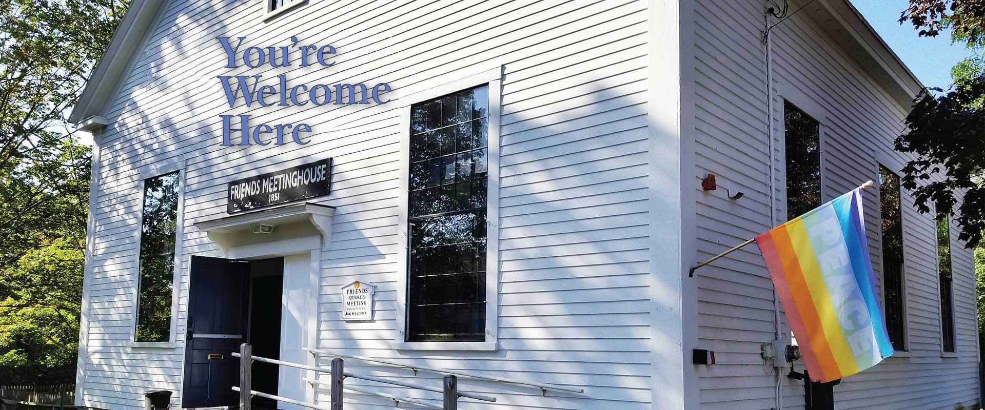 You are welcome here image of the front door of the meetinghouse