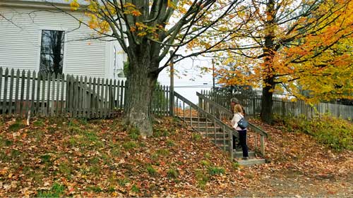 Two Friends walking up stairs to building